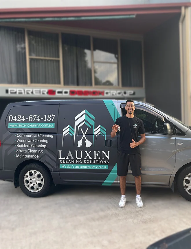 Lauxen Cleaning Solutions van with branded vehicle graphics.
